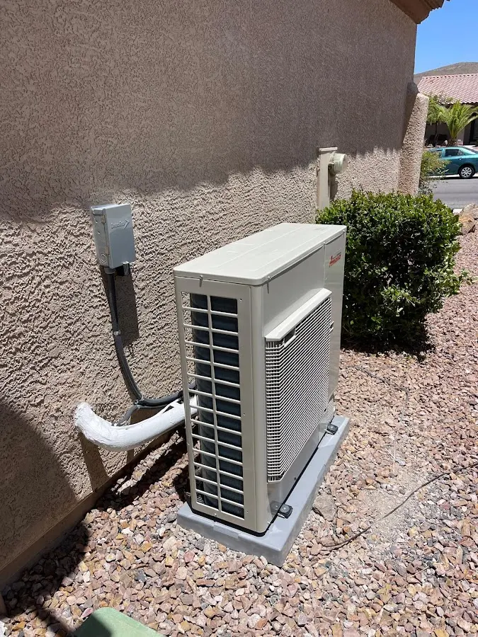 Residential air conditioning condenser unit in Belmont